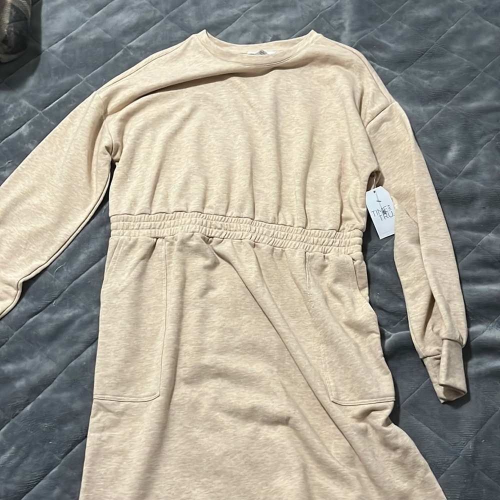 it is like a tan color and it's a dress